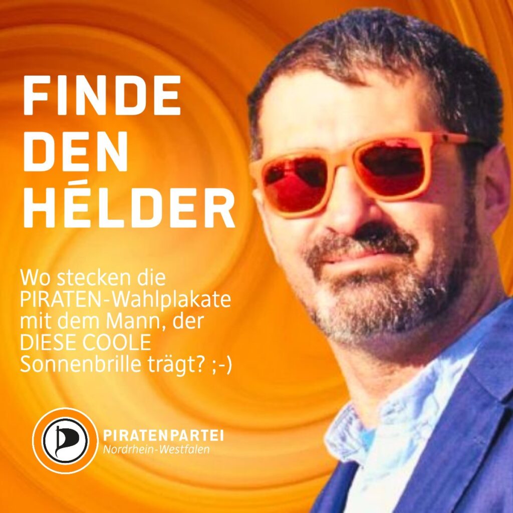 Sharepic der Piraten NRW: Vor einem Hintergrund mit einer Spirale in orangen Tönen ist ein Foto von Hélder Aguiar zu sehen, in dem er seine orange Sonnenbrille trägt. Großer Schriftzug "Finde den Hélder", darunter: "Wo stecken die Piraten-Wahlplakate mit dem Mann, der diese COOLE Sonnenbrille trägt? ;-) Piratenpartei NRW"
